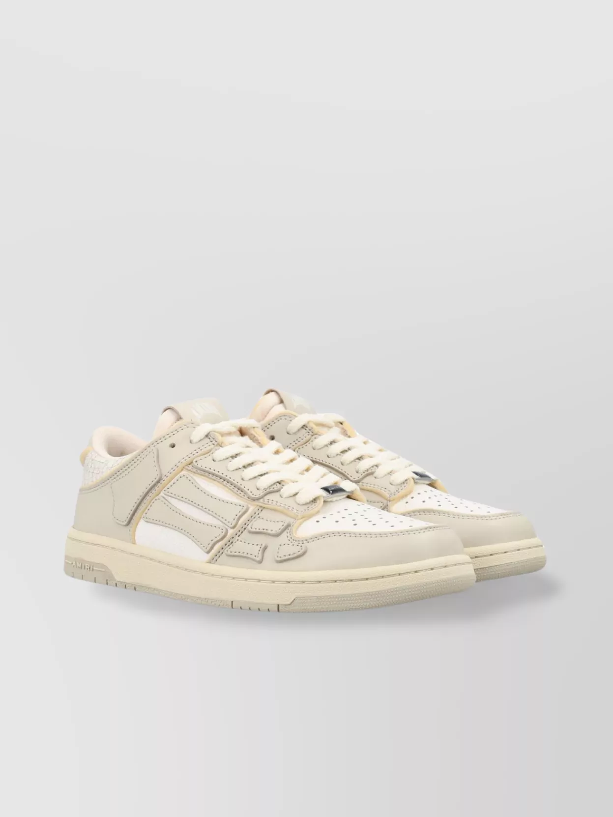 Amiri   Low top leather sneakers with panelled design