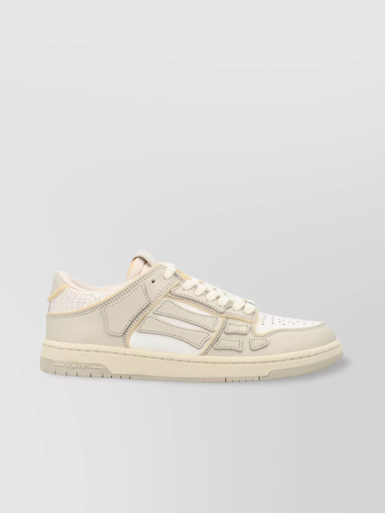 Amiri   Low top leather sneakers with panelled design