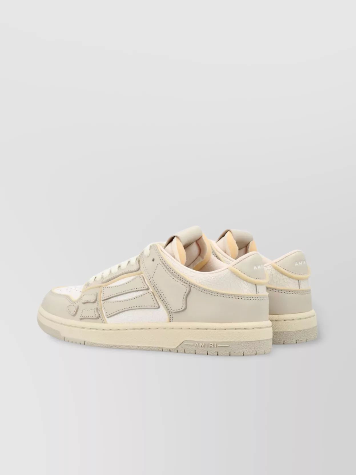 Amiri   Low top leather sneakers with panelled design